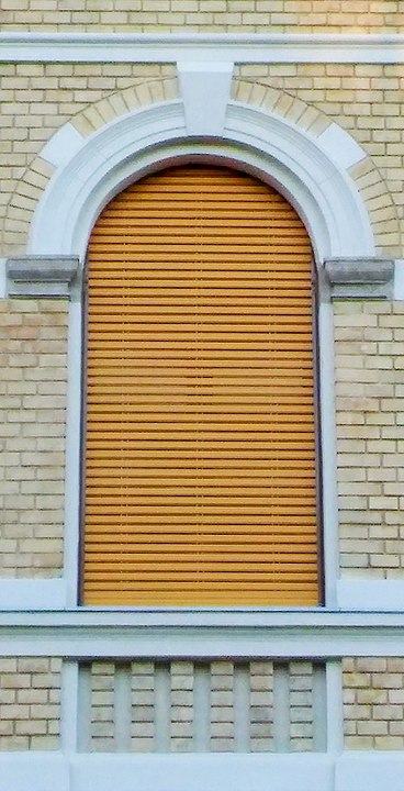 One of the windows with the shutters