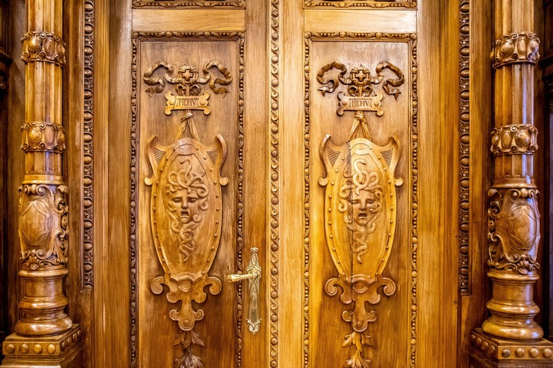 The wood carvings on the dining room door