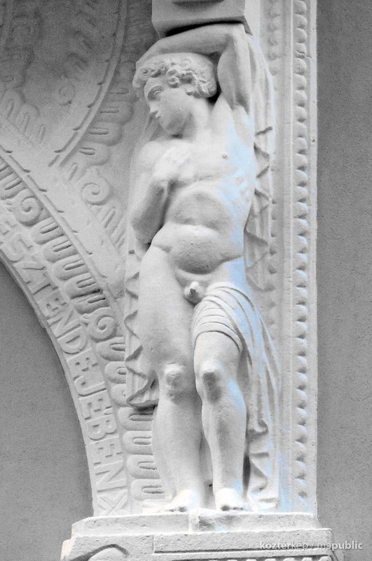 The male figure holding up the balcony