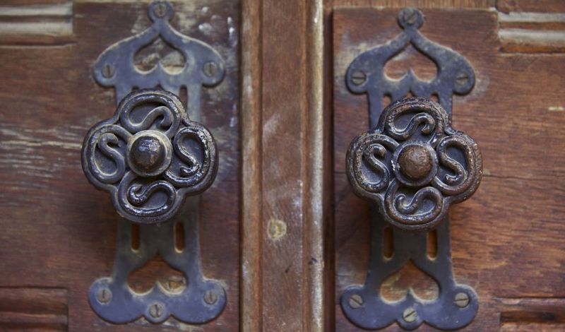 The iron handles of the entrance