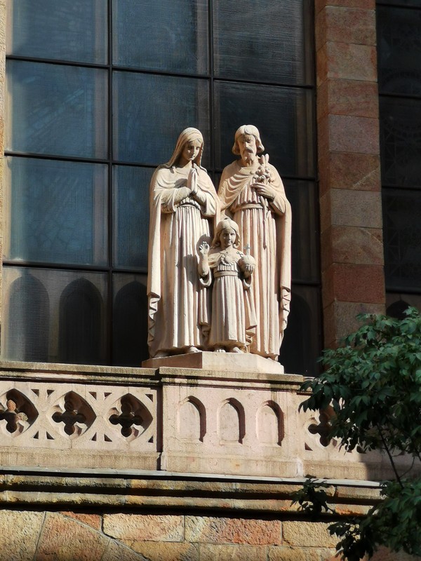 The group of statues of the Saint Family - a streetside ornament of the church