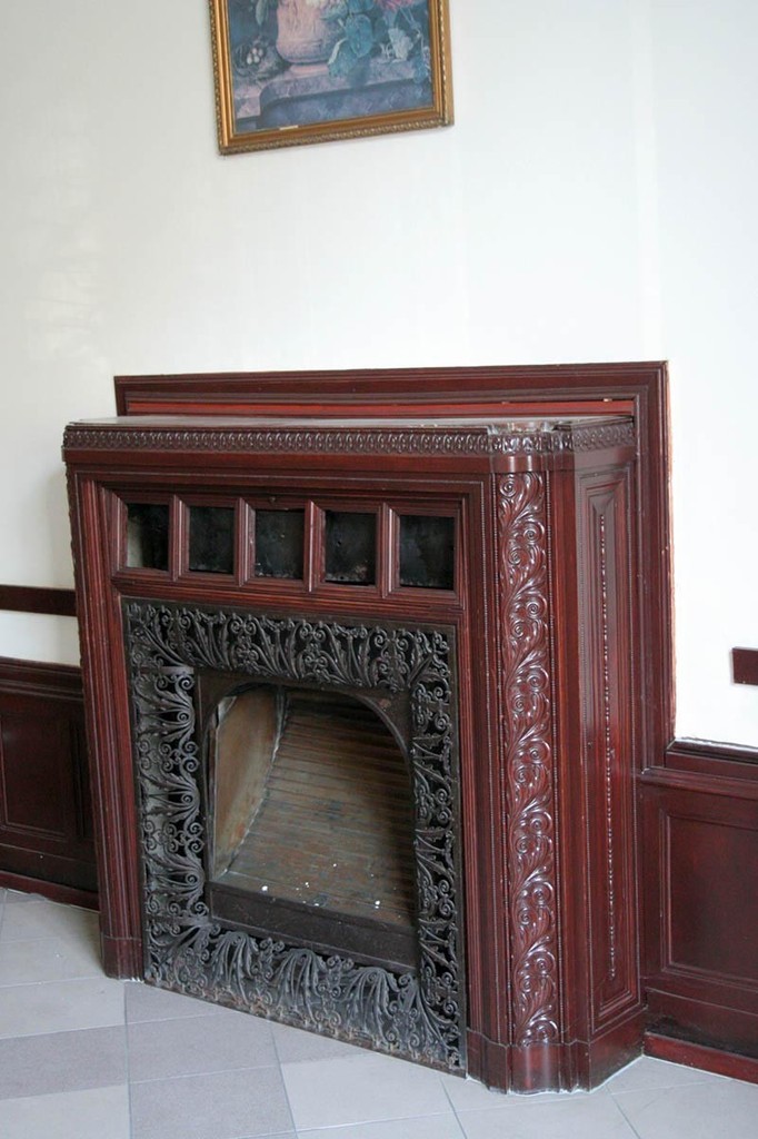 Fireplace with red wood covering