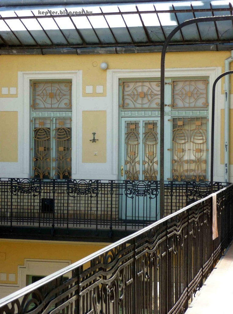 The wrought-iron rails and the grates on the doors and windows
