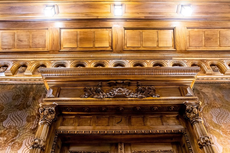 The wood carvings above the dining room door