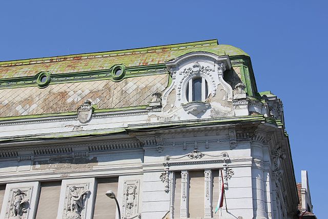 The roof and the corner facade