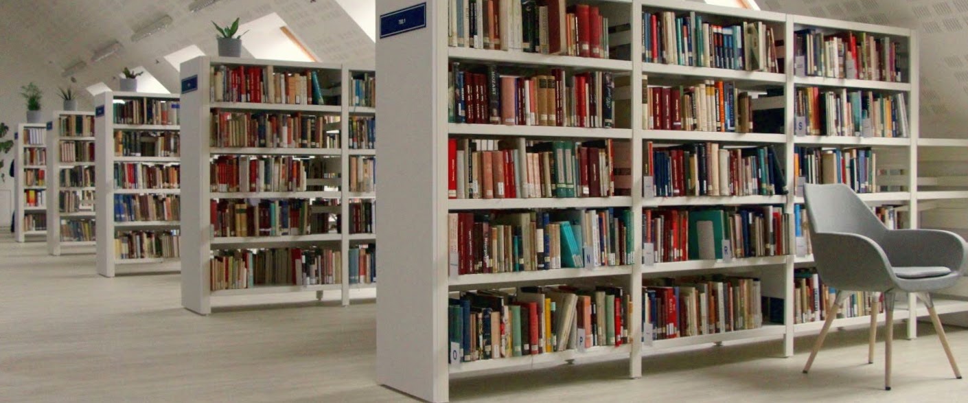 The reader's area of Music Collection with shelves full of books.