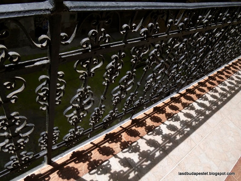 Iron railing on the gallery overlooking the courtyard