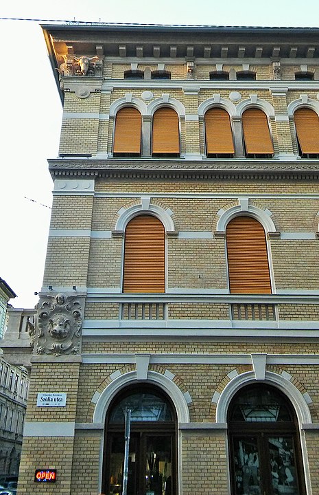 The windows with orange shutters