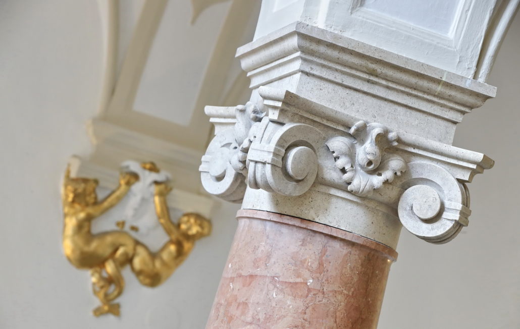 Pillar heads in the main staircase