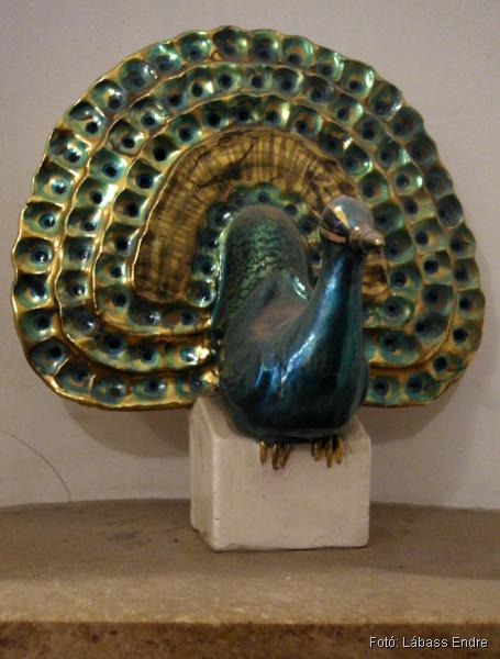Decorative peacock in the niche