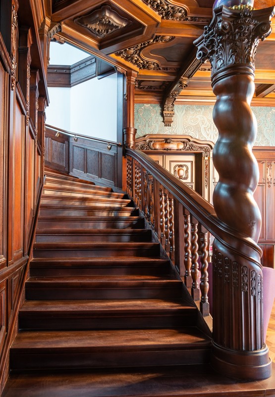 The wooden staircase in the entrance hall